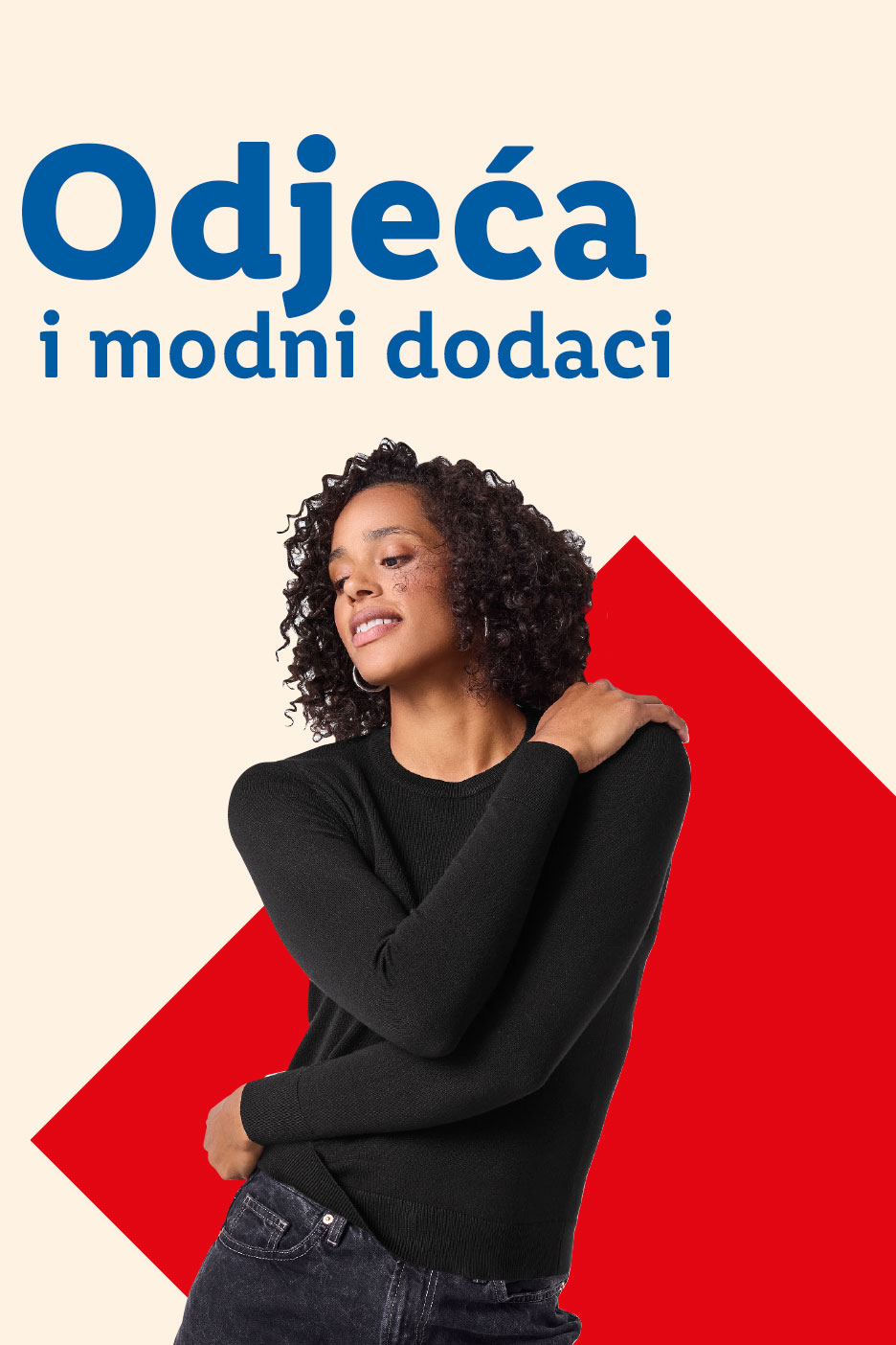 Odjeća i modni dodaci: Žena u crnom džemperu i trapericama, s crvenim geometrijskim oblicima.